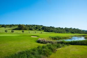 Morgado Golf Course green fairway and lake